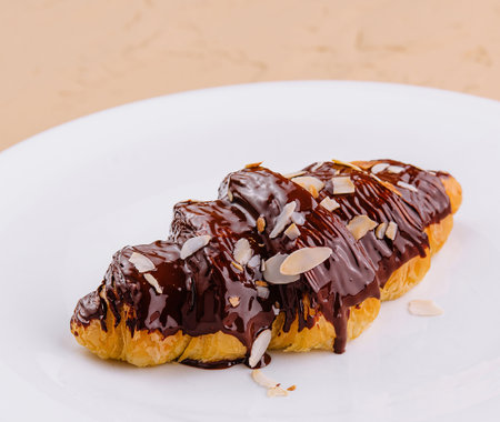 fresh baked croissant with chocolate and almonds