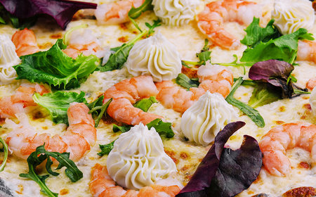 black pizza with shrimp and creamの写真素材
