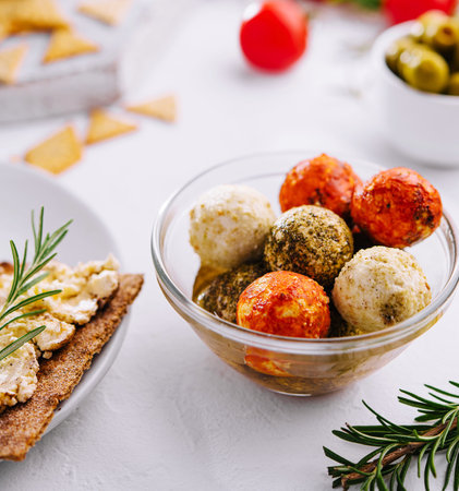 Small balls of goat cheese rolled in different spicesの写真素材