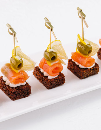 canapes with cheese and red fishの写真素材