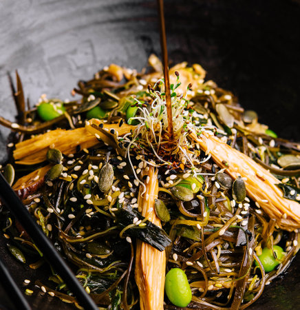 Spicy dish, noodles with meat and vegetables in wok panの写真素材