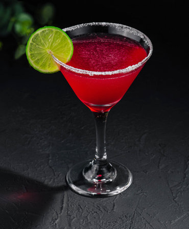 martini glasses of red alcohol drink on stoneの写真素材