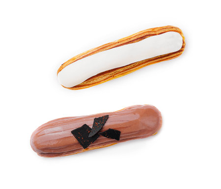 Chocolate and vanilla eclairs on a white background