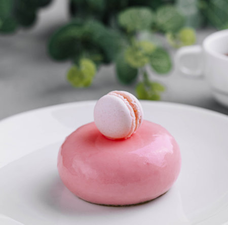 Pink mousse cake decorated close up