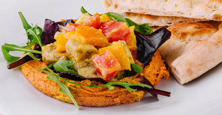 Healthy roasted red pepper hummus and pita breadの写真素材