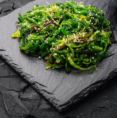 wakame chuka salad with spicy sauce on stone boardの写真素材