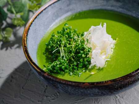 Broccoli, spinach cream soup in a bowlの写真素材