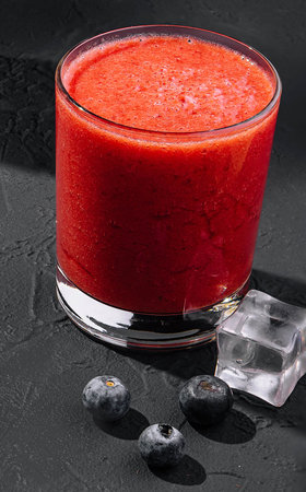 Strawberry smoothie on stone close upの写真素材