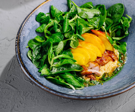 Appetizing pork meat baked with mango and cheeseの写真素材