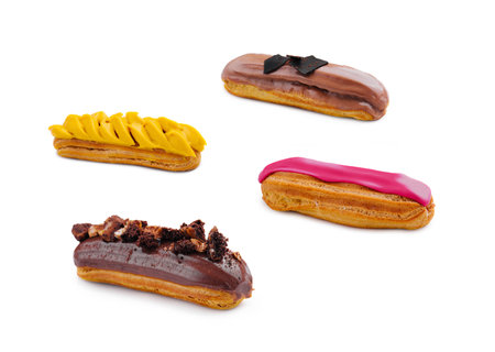 four different eclairs isolated on white backgroundの写真素材