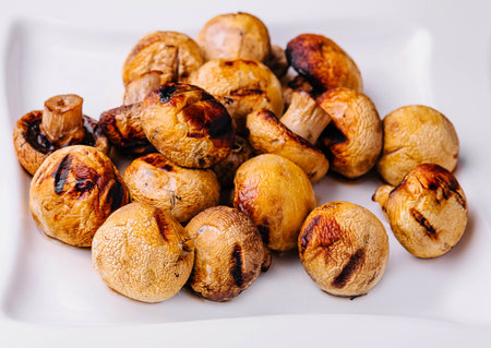 Baked mushrooms in plate close upの写真素材