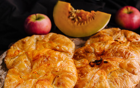 Cooking traditional pies with apple and pumpkin close upの写真素材