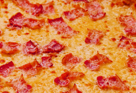 Pizza with bacon and cheese close up