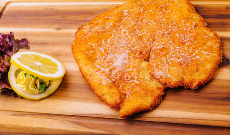 Schnitzel with salad on a board