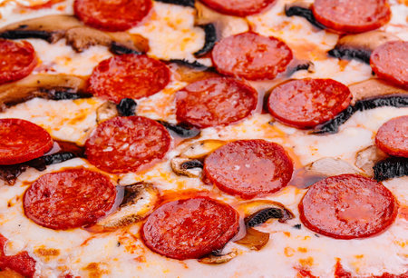 `Pepperoni pizza with sausage close upの写真素材