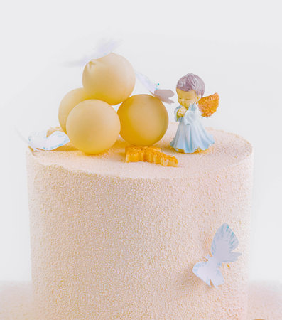 baby cake with angel isolated on whiteの写真素材