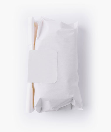 Top view of a neatly wrapped package with a blank label for branding