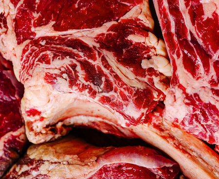 High-quality image showcasing an array of raw beef cuts with marblingの写真素材