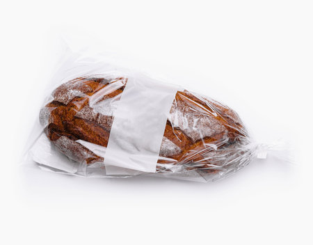 Sealed rye bread with a label, isolated on a white background, ready for saleの写真素材
