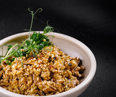 Gourmet spiced rice served in a white bowl garnished with fresh herbs, perfect for culinary conceptsの写真素材