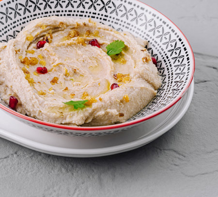 Traditional hummus served on a decorative plateの写真素材
