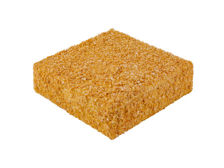 Square honey cake covered with crumbs standing on white backgroundの写真素材