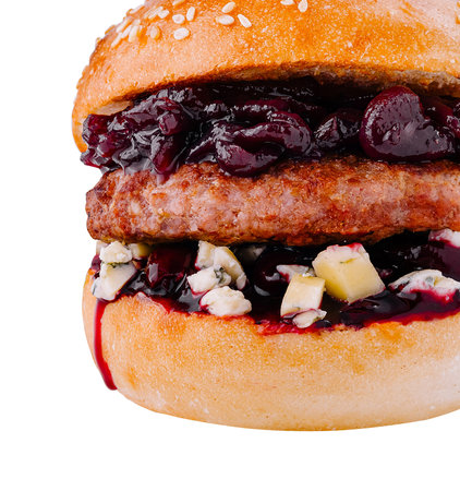 Freshly made burger with blue cheese and cherry sauce isolated on a white backgroundの写真素材