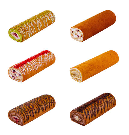 Six different sponge roll cakes are laying horizontally on a white background, showing a variety of flavors and toppingsの写真素材