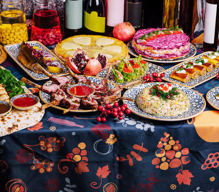 Lavish dinner setting with a variety of gourmet dishes, perfect for celebrations and feastsの写真素材