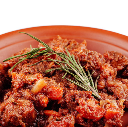 Aromatic beef stew with carrots, herbs and spices, simmering in a rich sauceの写真素材