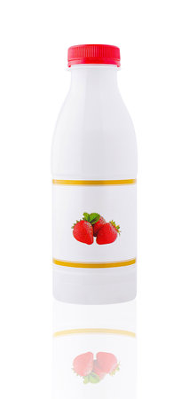 White plastic bottle with fruit yogurt and red cap standing on white backgroundの写真素材