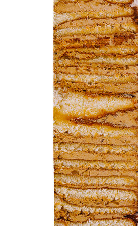 Close-up of a multi-layered cake with caramel filling, creating a tempting visual delightの写真素材