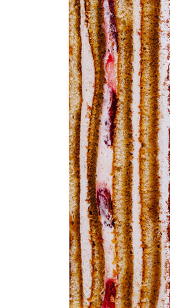 Close-up view revealing the delectable layers of a cake, featuring alternating layers of moist cake,...