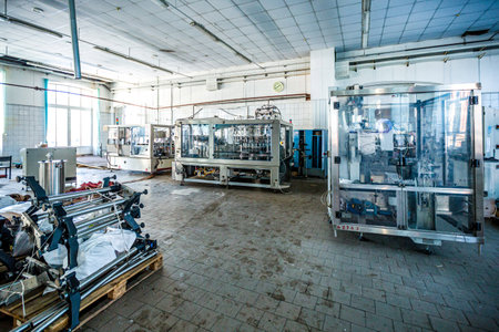 Industrial equipment in the workshop of an old abandoned factory in Moscow, Russiaの写真素材