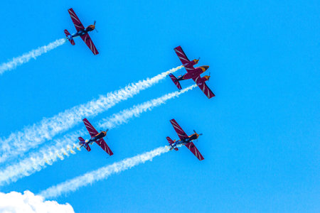 Aerobatic team First Flight performs demonstration flights on piston aircraft at the air show in...