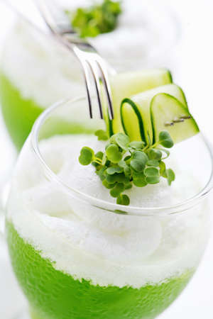 Light air protein cocktail with fresh cucumber juice, foam and micro greensの写真素材