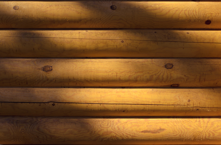 Shield with a large number of parallel wooden logs - closeup backgroundの写真素材