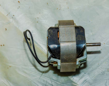 Close-up of a very dirty kitchen exhaust fan. Fan before preventive cleaning and washing. Dirty details.の写真素材