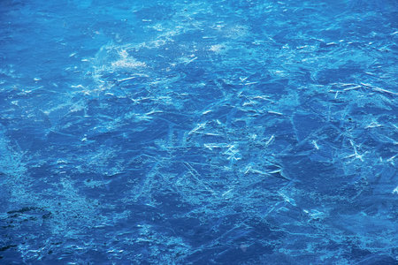 Winter nature background with blocks of ice on frozen water in spring. Abstract background of drifting ice on water.の写真素材