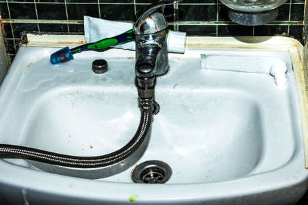 Water meter verification process. A flexible water hose is connected to the water tap. water saving...