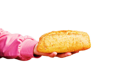 Bread in the hand of a middle-aged woman. The concept of the world food crisis associated with the war in Ukraine. isolated on white background.の写真素材