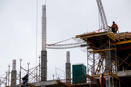 Dnepropetrovsk, Ukraine - 02.18.2022: A worker prepares formwork for a modern metal-concrete...