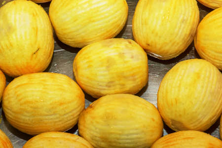 fresh citrus background. Lemons with peeled zest are on the table.の写真素材