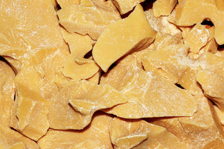 Cocoa butter background, top view, texture. Cocoa butter is one of the ingredients in making chocolate at home. Close-up of crushed cocoa butter, top view.の写真素材