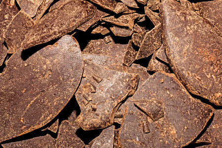 Graded cocoa background, top view, texture. Graded cocoa is one of the ingredients in making chocolate at home. Close-up of crushed cocoa, top view.の写真素材