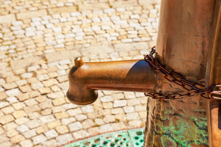 Nitra, Slovakia - 06.10.2022: Retro borehole pump on a sunny day, old manual water pump (lever pump). Monument in Slovakia in the city of Nitra.のeditorial素材