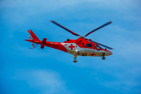 Nitra, Slovakia - 06.17.2022: An ambulance helicopter flies up to the building of the cardiology hospital in the city of Nitra.のeditorial素材