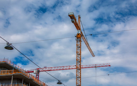 Vienna, Austria - 06.13.2022: Crane and construction site against blue skyのeditorial素材