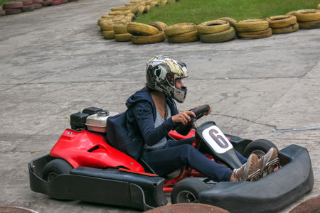 Dnipro, UKRAINE - 03/09/2021: Karting. Go Kart on the track. Young positive racers driving a kart...