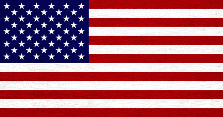 Flag of the United States of America on a cement wall texture.の写真素材